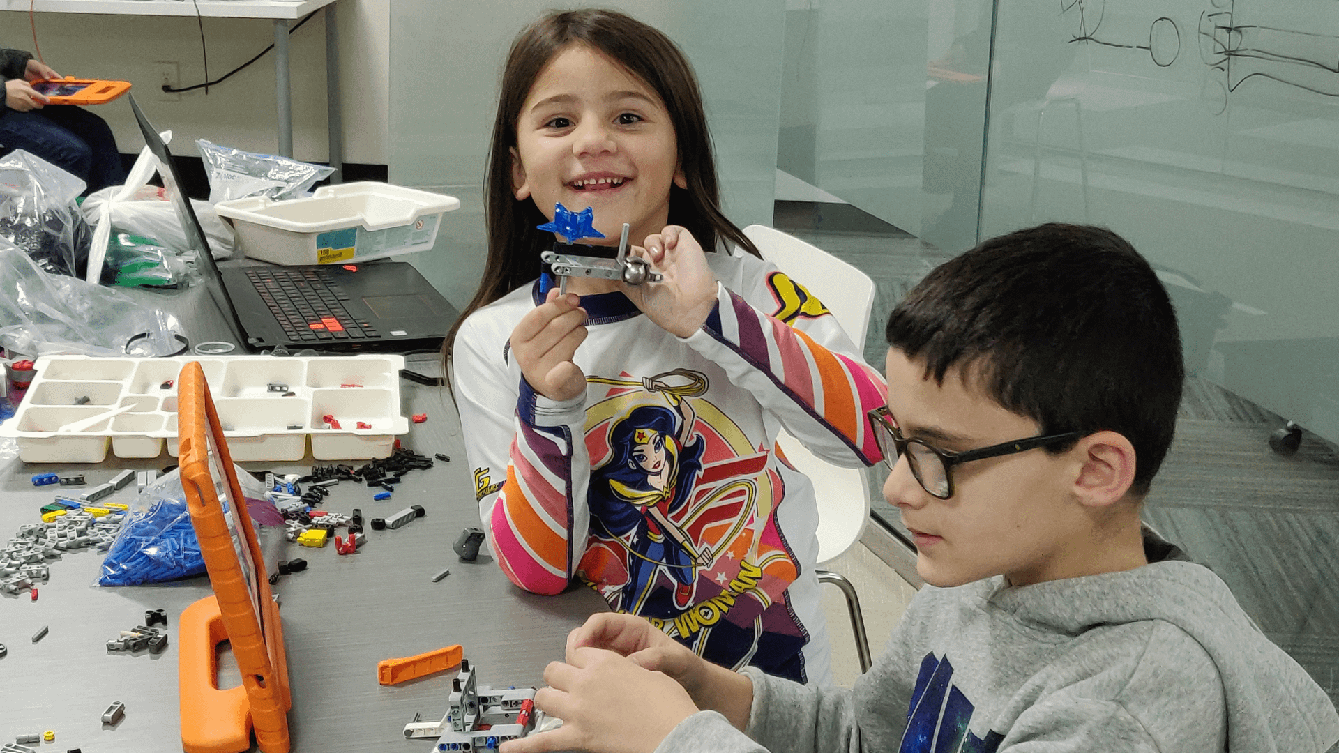 STEM Education - Kids working on a robot design at iCode school classroom