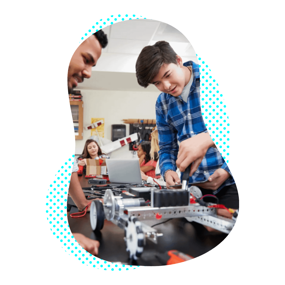 A teenager works on a Robot